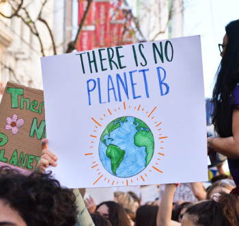 Crowd of protestors, with a sign saying there is no planet B